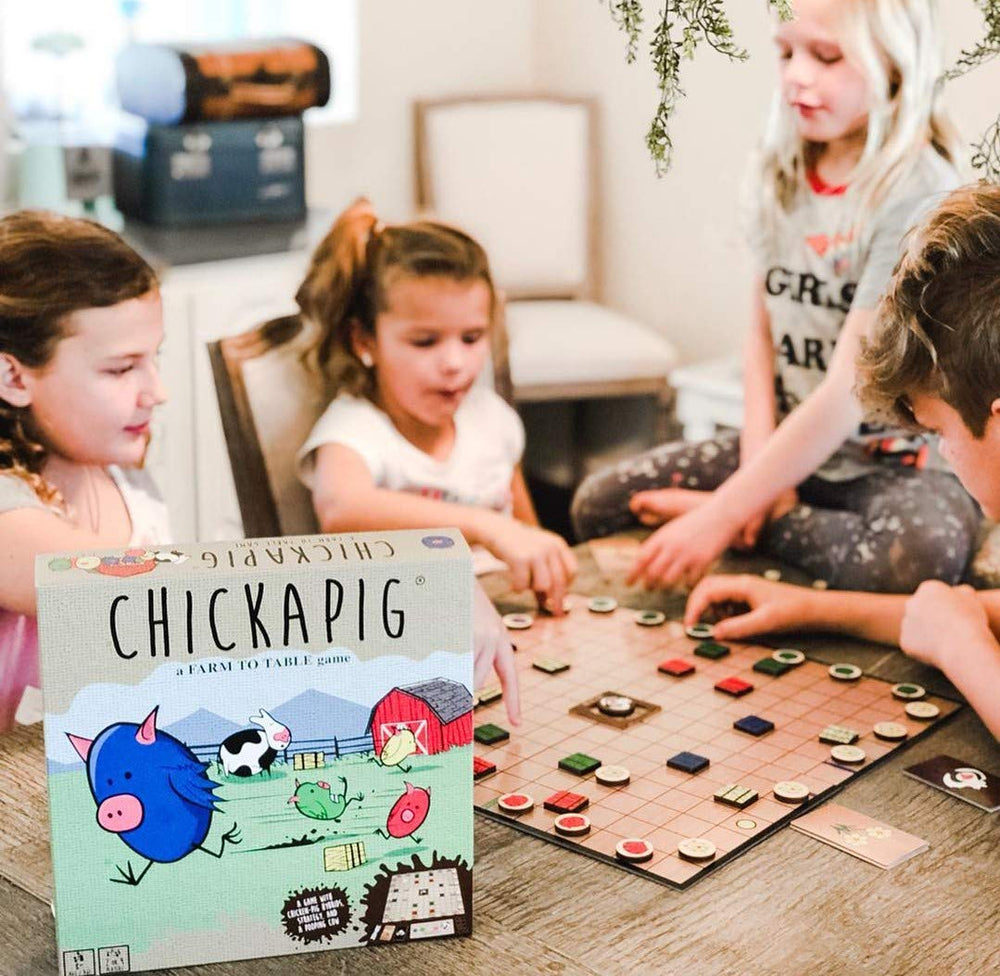 Buffalo Games Chickapig cow figure in action, adding playful chaos to gameplay.