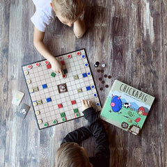 Buffalo Games Chickapig board game on a cozy living room table setting.
