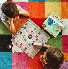 Buffalo Games Chickapig hay bale obstacles on the board, creating strategic blocks.