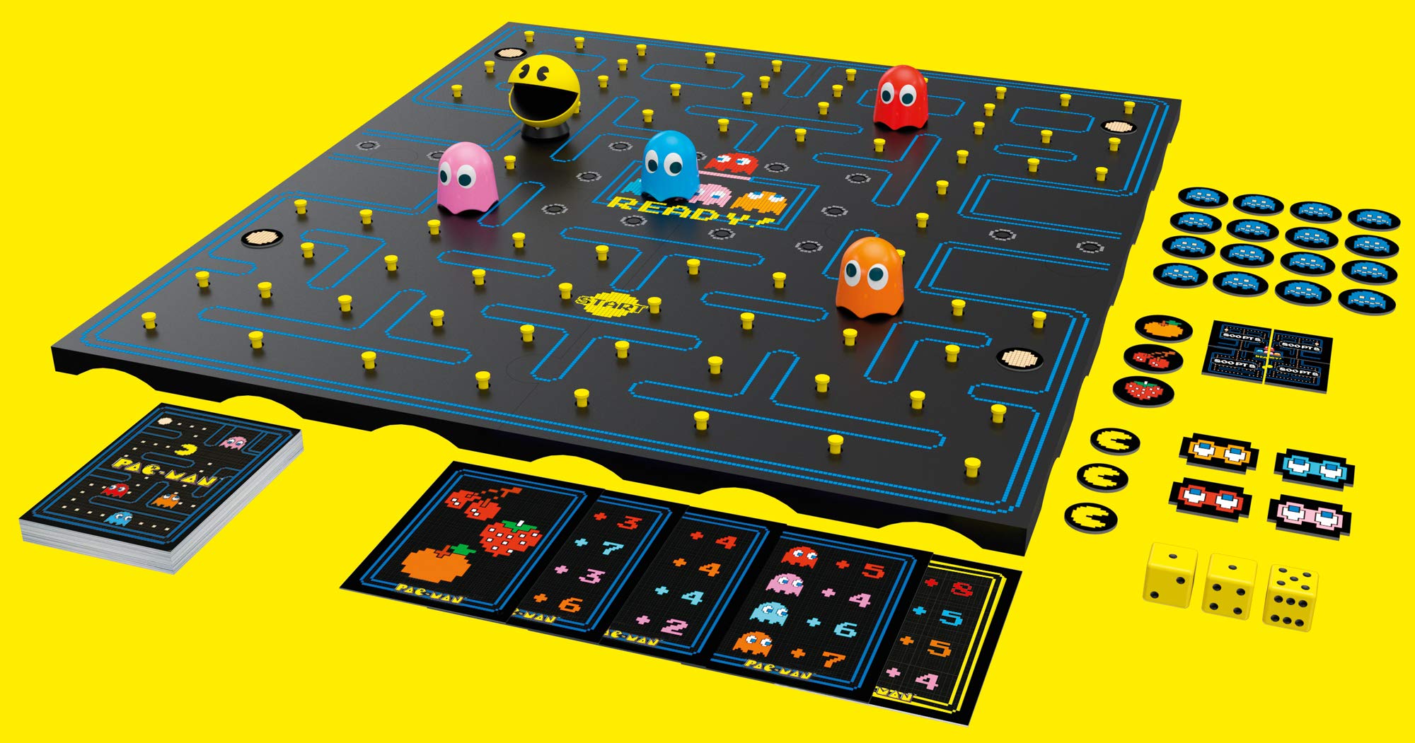 Pac-Man board game setup showing maze tiles and colorful components by Buffalo Games.