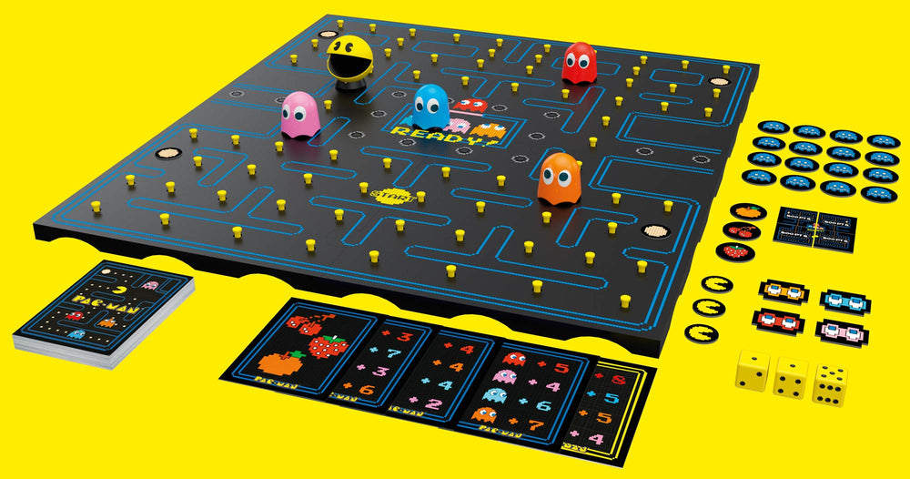 Pac-Man board game setup showing maze tiles and colorful components by Buffalo Games.