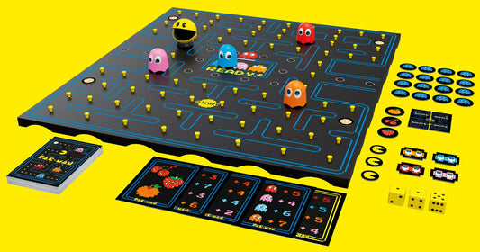Pac-Man board game setup showing maze tiles and colorful components by Buffalo Games.