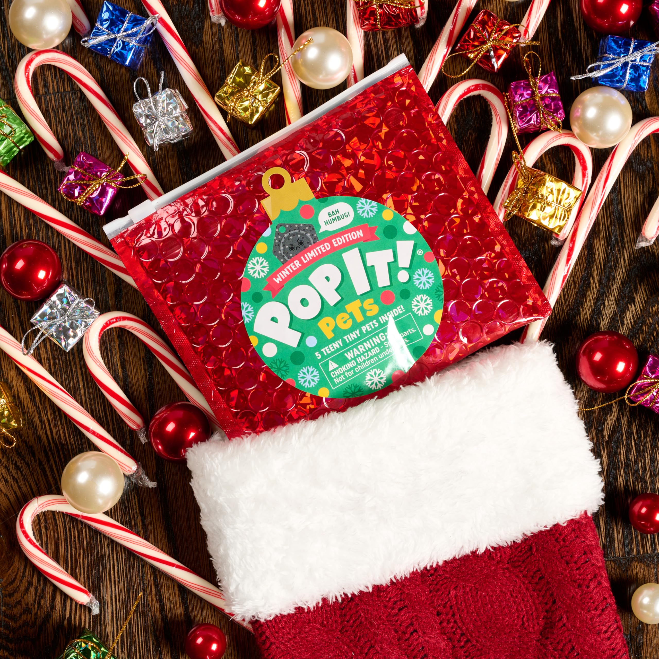 Buffalo Games Pop It Pets Winter collector grid helps organize surprises.