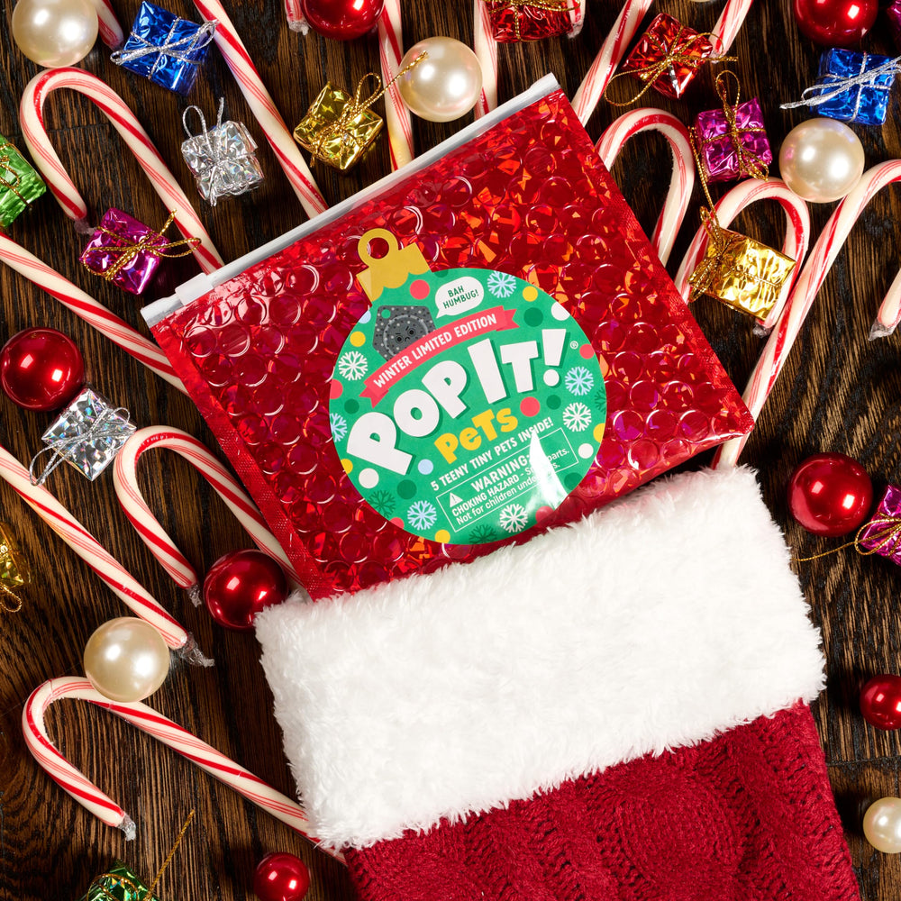 Buffalo Games Pop It Pets Winter collector grid helps organize surprises.