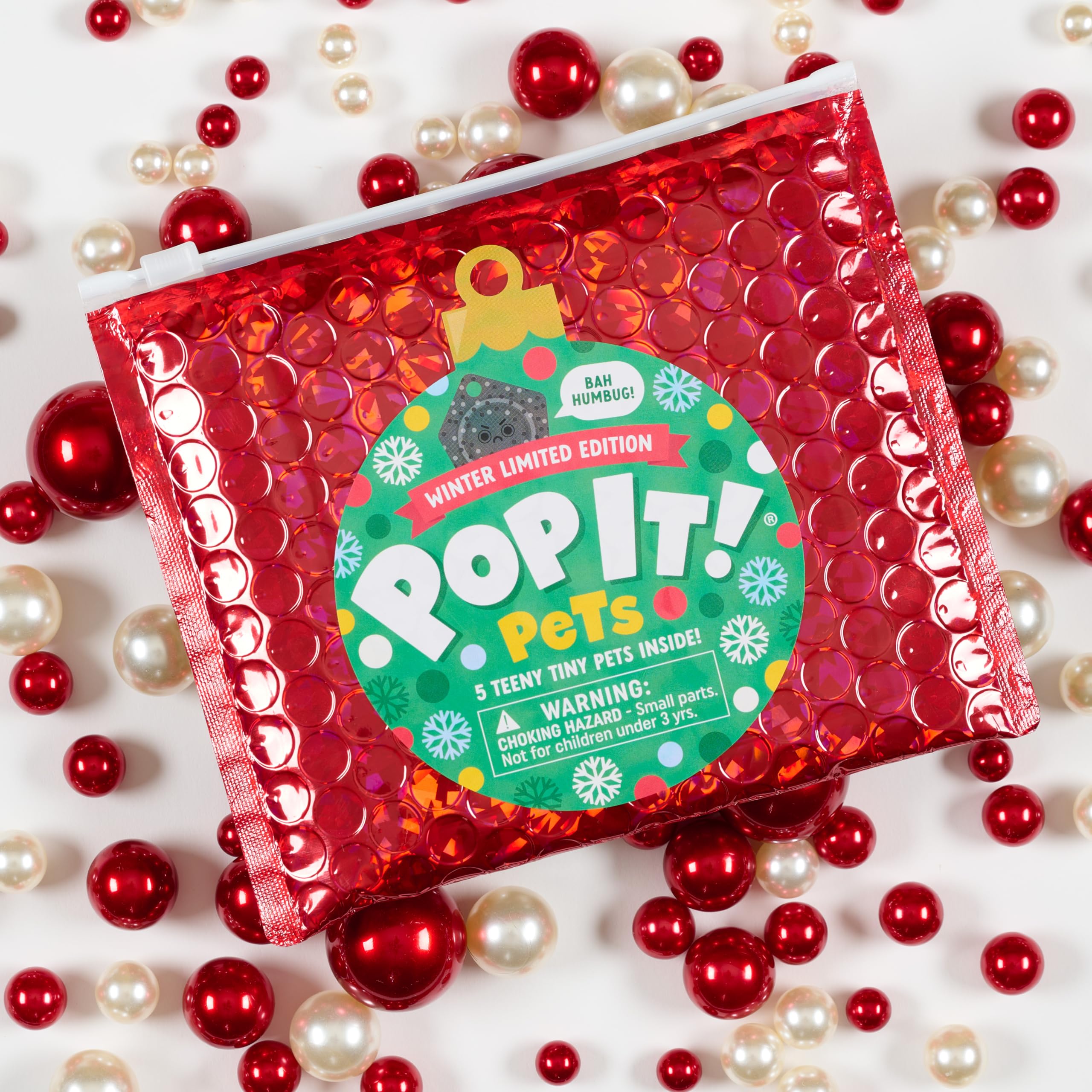 Buffalo Games Pop It Pets Winter keychain keeps holidays on the go.