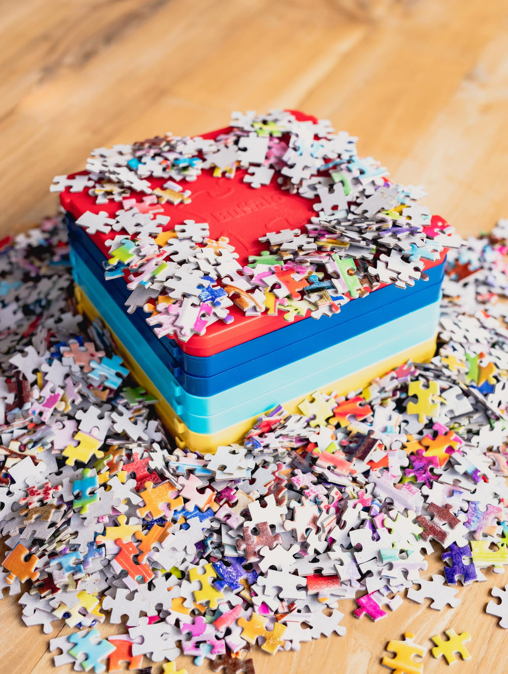 Buffalo Games puzzle sorting trays on table with pieces for organized view.