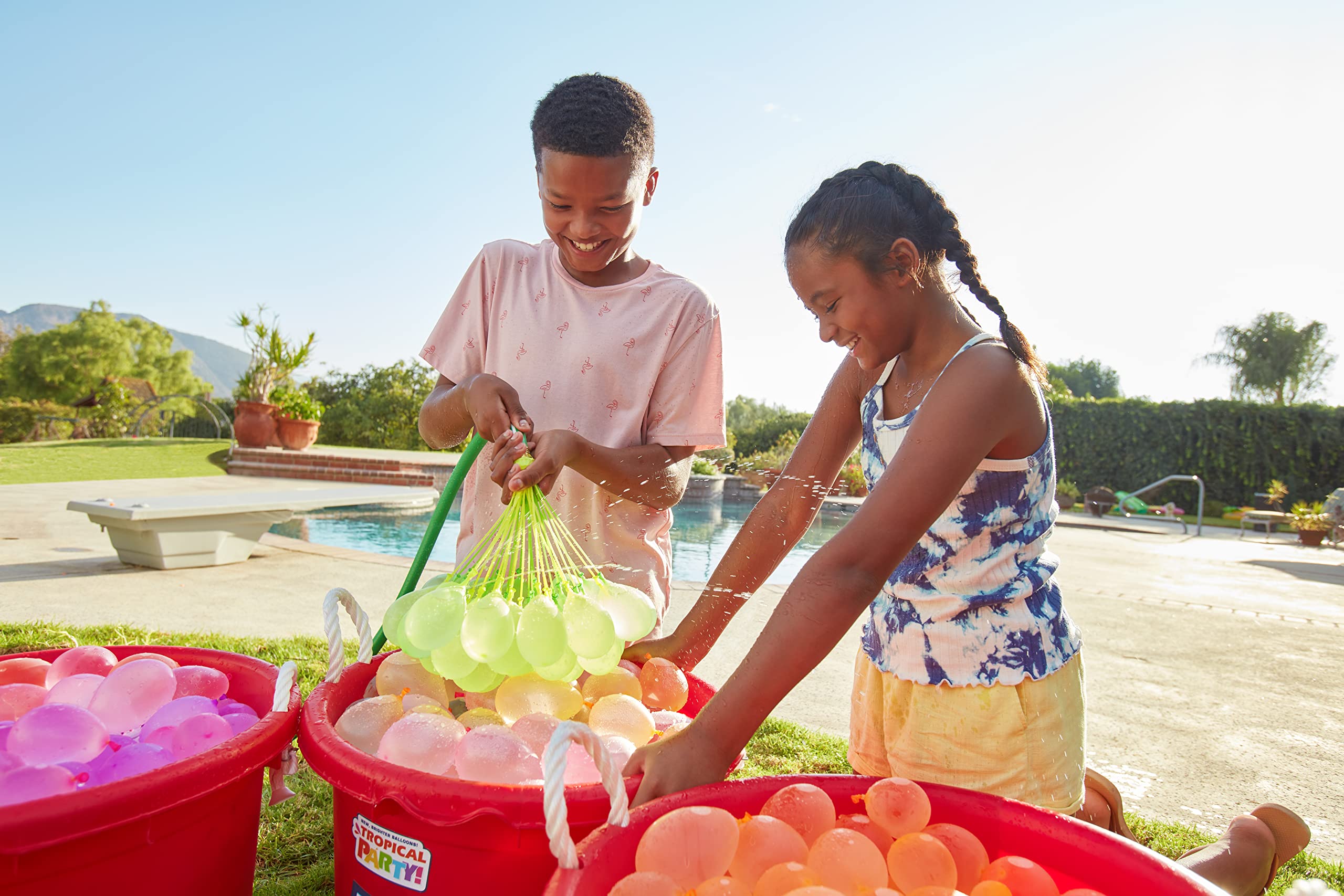 Vibrant tropical colors from Bunch O Balloons brighten poolside celebrations.