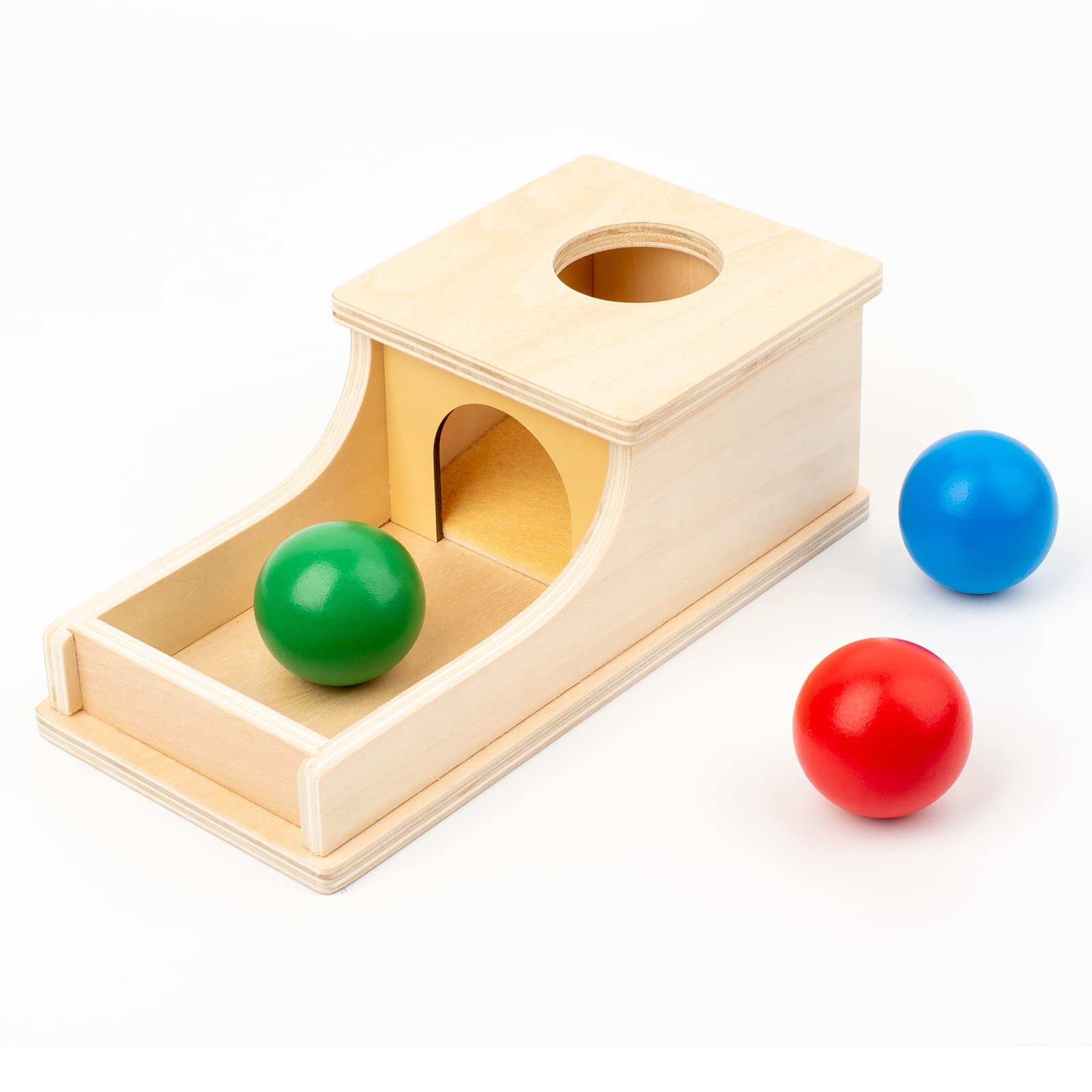 Busy Edition object permanence box promotes exploration with bright wooden colors.