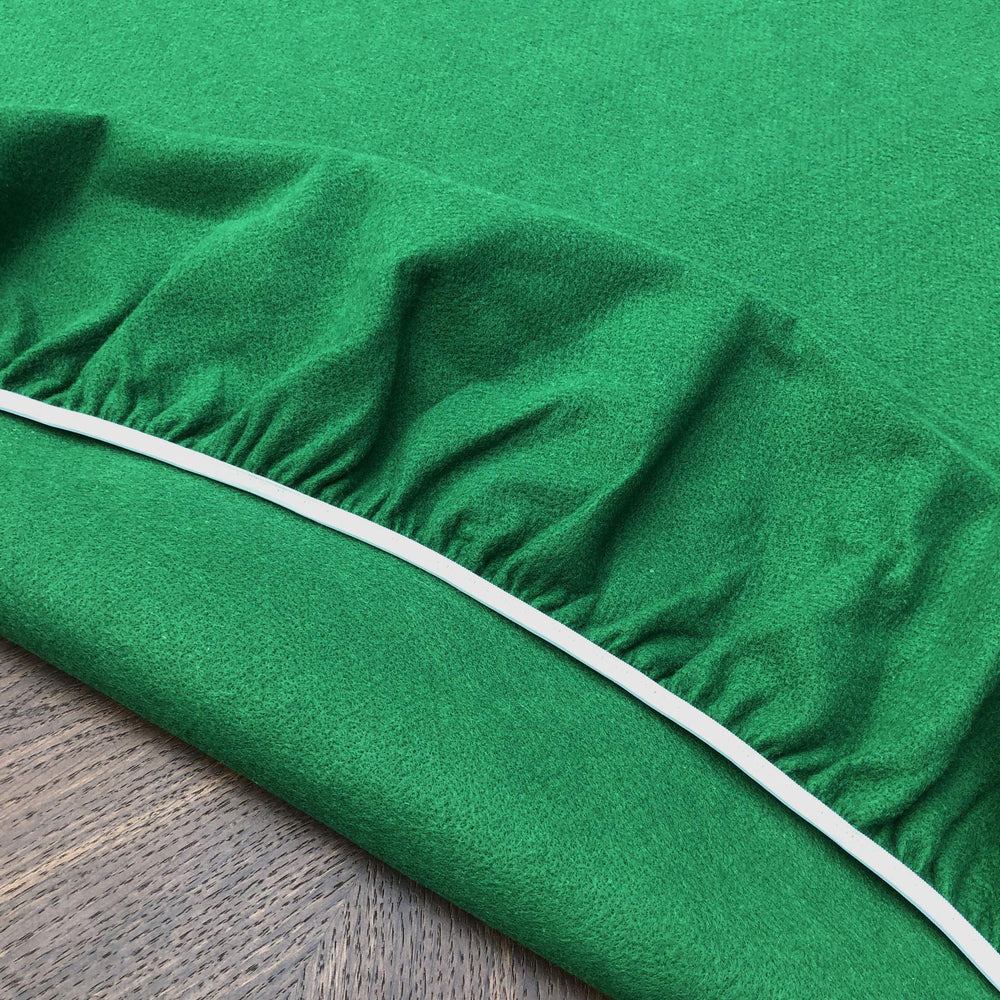 CAIT CHAPMAN HOME COLLECTION washable green felt table cover ready for easy cleanup after play.