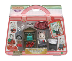 Calico Critters Fashion Playset: Tuxedo Cat Felicia wearing a chic outfit for imaginative dress-up.