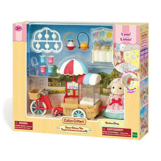 Calico Critters Popcorn Trike with rotating wheels enhances interactive play.