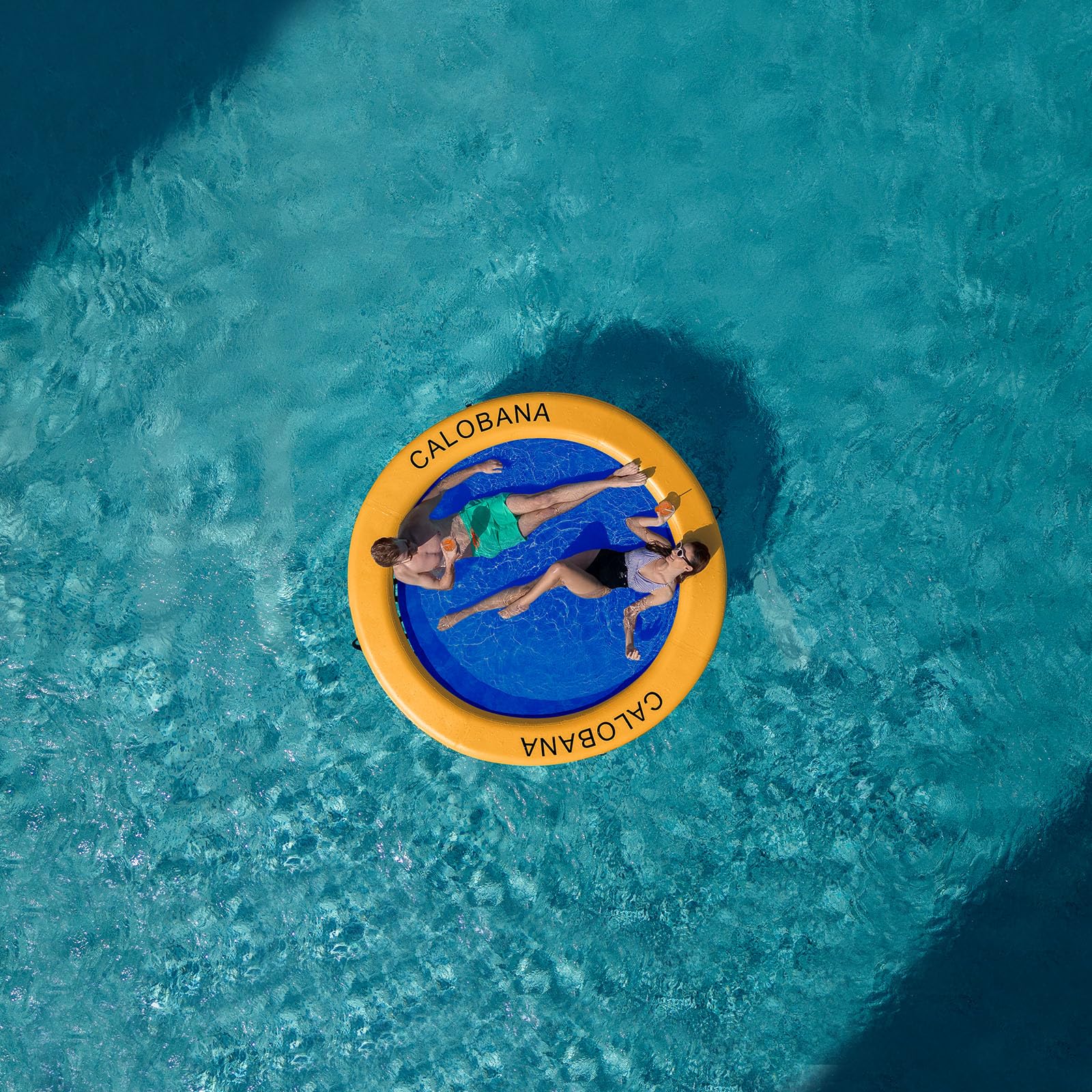 CALOBANA round floating mat used as sun deck for relaxing on lake