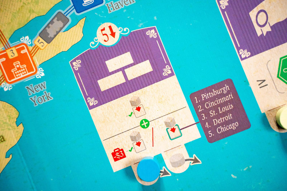 Capstone Games Age of Rail components pack with cards and markers.
