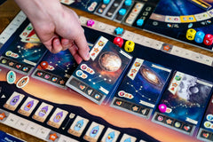 Capstone Games Galileo Galilei players around table enjoying competitive telescope upgrades
