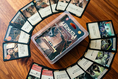 Capstone Games Pagan: Fate of Roanoke card decks highlight witch and hunter dynamics for strategic deduction.