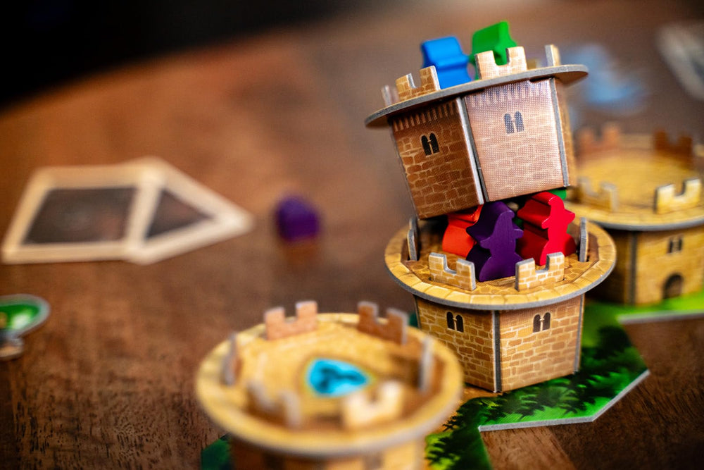 Capstone Games Wandering Towers board layout highlights routes to Ravenskeep.