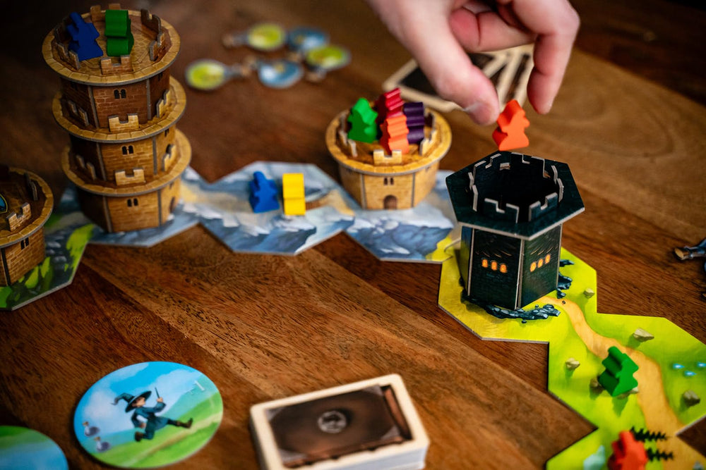 Capstone Games Wandering Towers die token marks turn order and fate.
