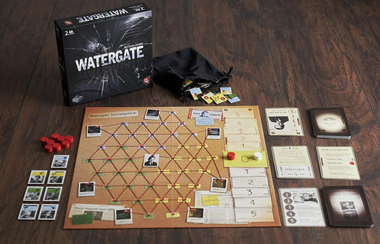 Capstone Games Watergate box and components on display, highlighting tactile setup for a fast two-player match.