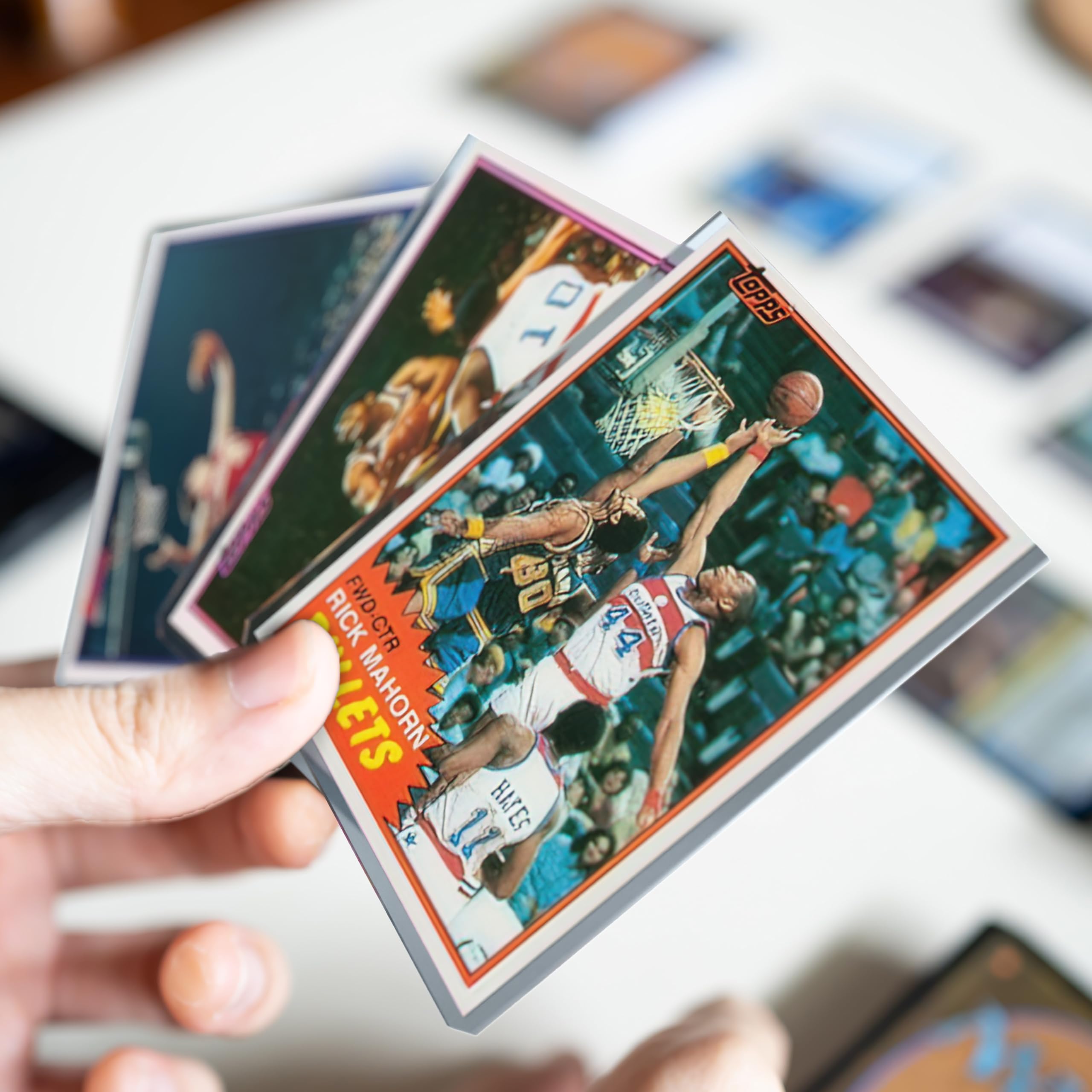 Cardboard Gold 35pt toploader includes soft sleeves for added security.