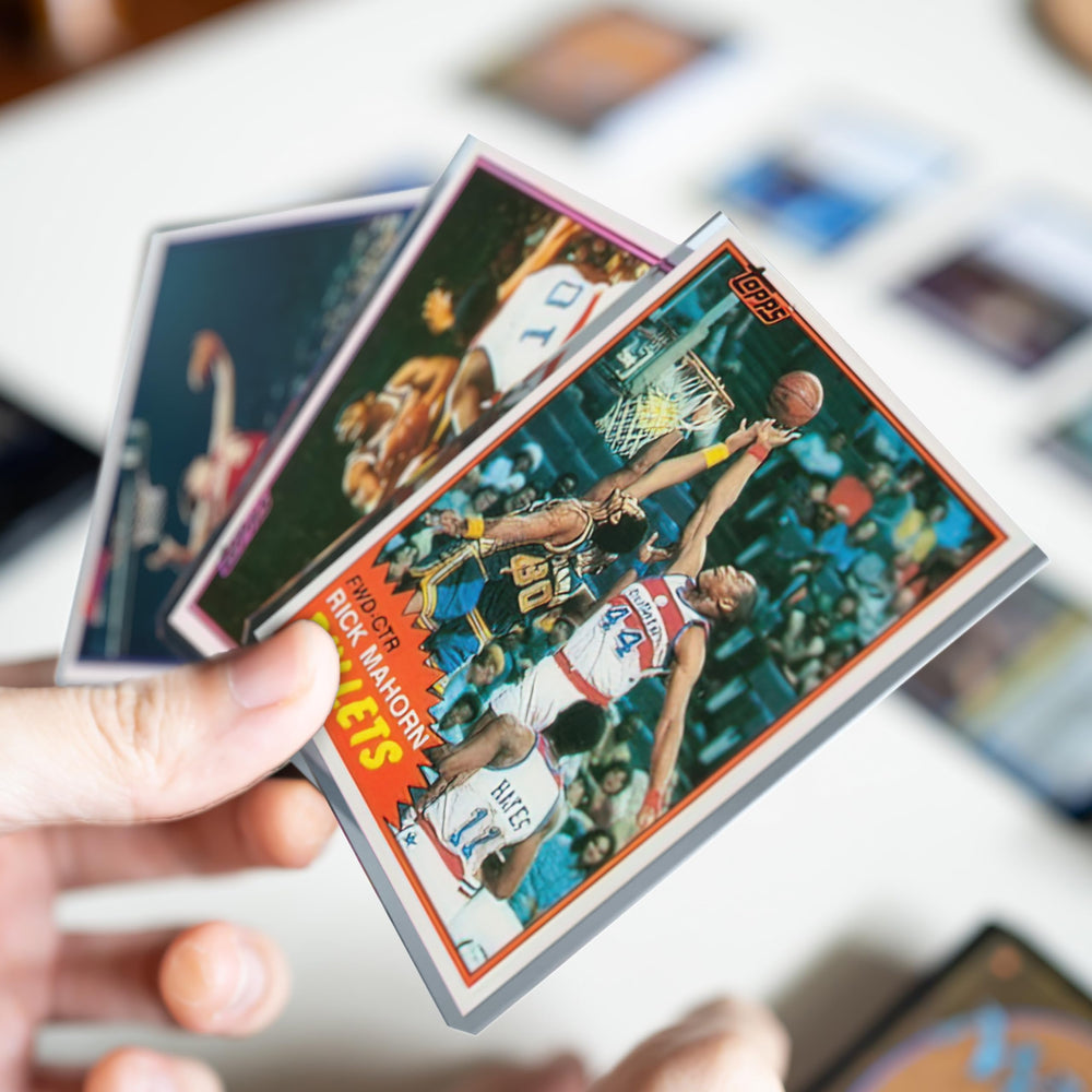 Cardboard Gold 35pt toploader includes soft sleeves for added security.