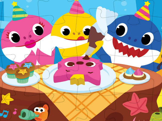 Cardinal Baby Shark 24pc puzzle assembled on the floor ready for family game night.