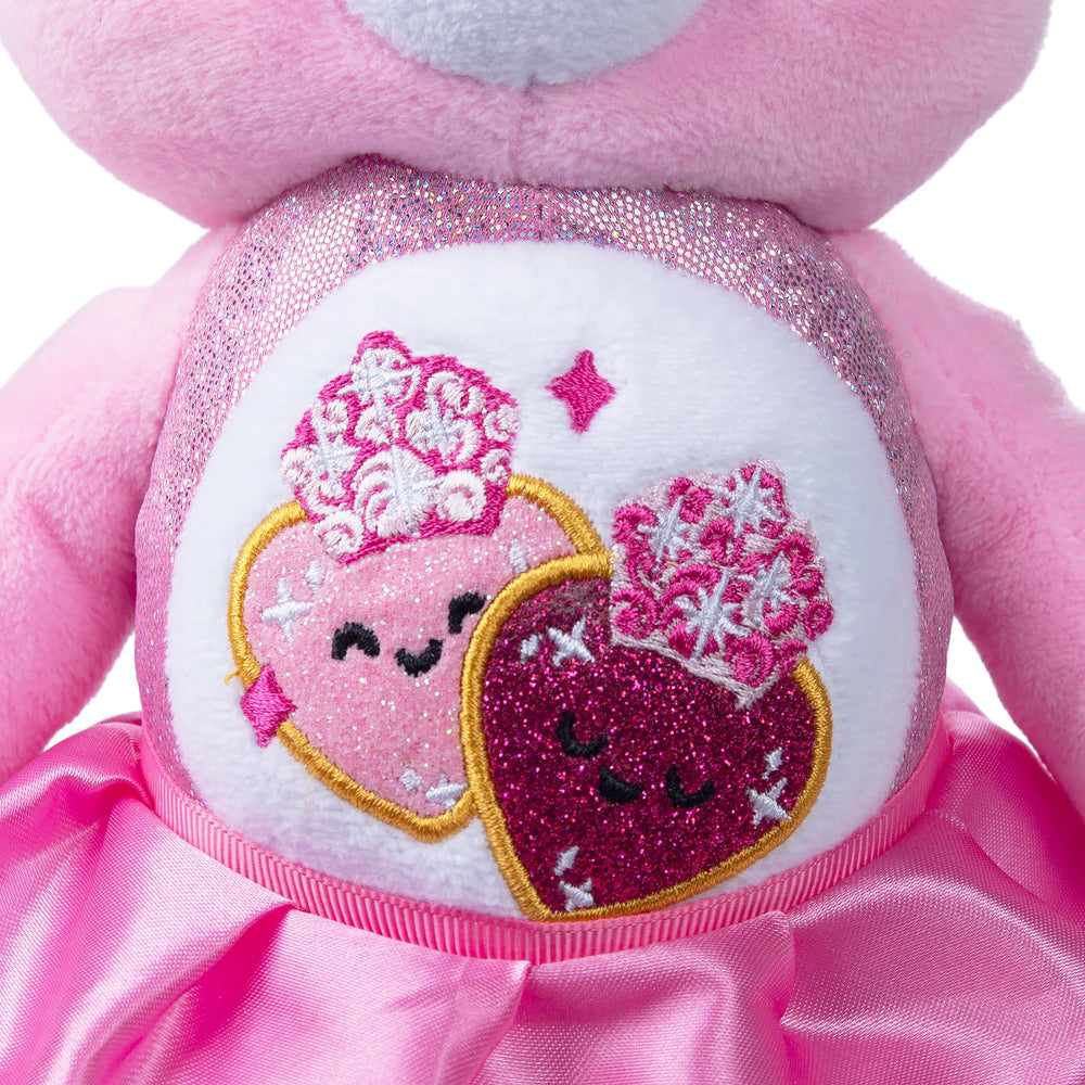 Care Bears Belly Badge with crown accents, celebrating the crossover design