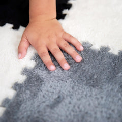 CARPETBOX baby play mat provides warm, comfortable tummy-time surface.