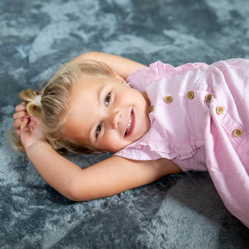 CARPETBOX interlocking foam tiles form a flat, secure surface.