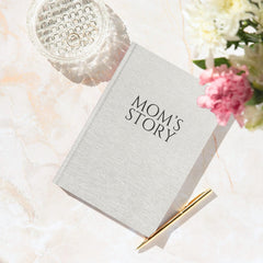 CATCHYOURDREAMS Mom's Story Journal open prompts page guiding reflection.