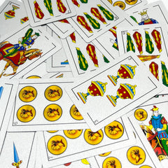 CDBXRA Spanish playing cards in hand, portable for family gatherings and travel.