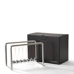CERROPI Newtons Cradle on a desk setup as a conversation starter.