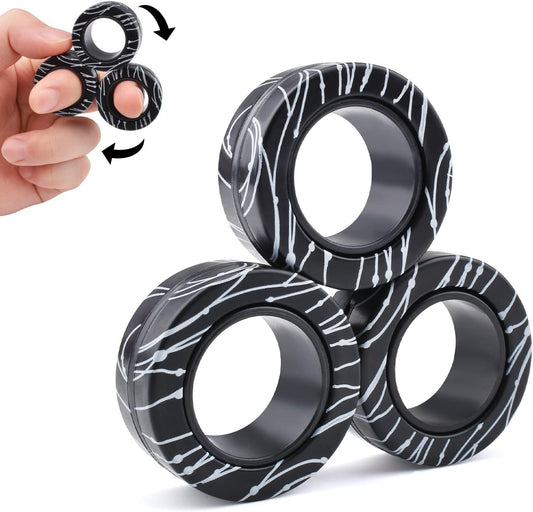 Cevioce magnetic rings set front view showing portable stress relief in one hand