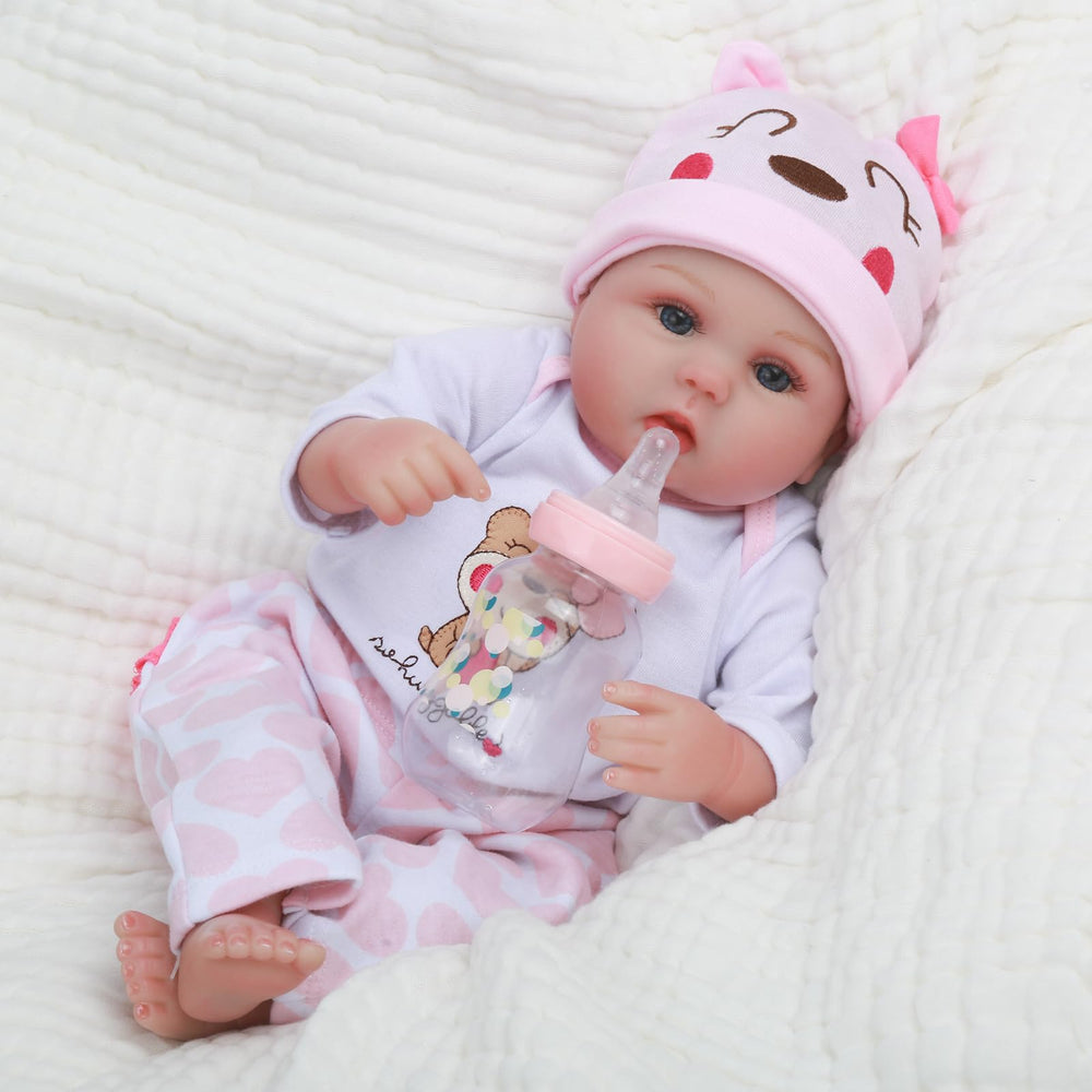 CHAREX Lucy 16in gift box includes outfit, hat, socks, pacifier, and bottle.
