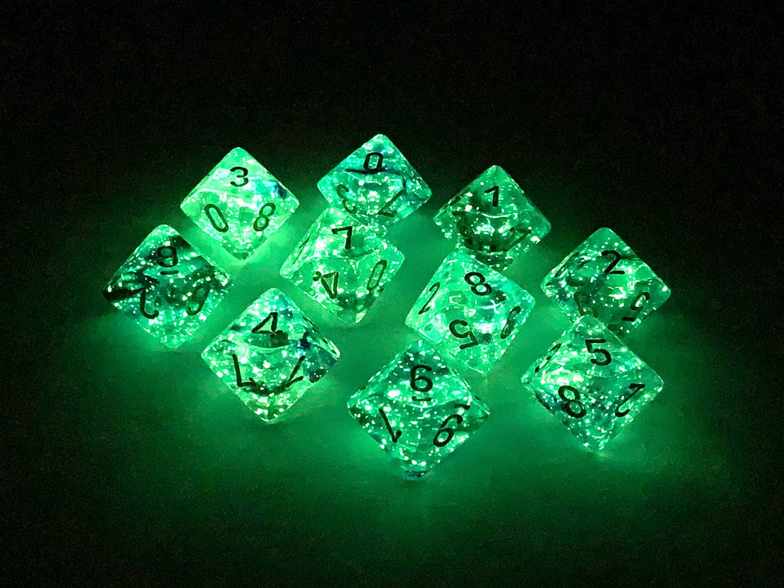 Oceanic D10 dice by Chessex with glow flecks for clearer low-light rolls.