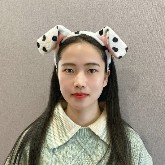 CHEU dalmatian ears headband worn by a child at a party