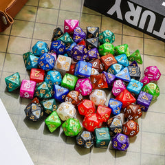 CiaraQ colorful dice set spread on a tabletop for RPG sessions.