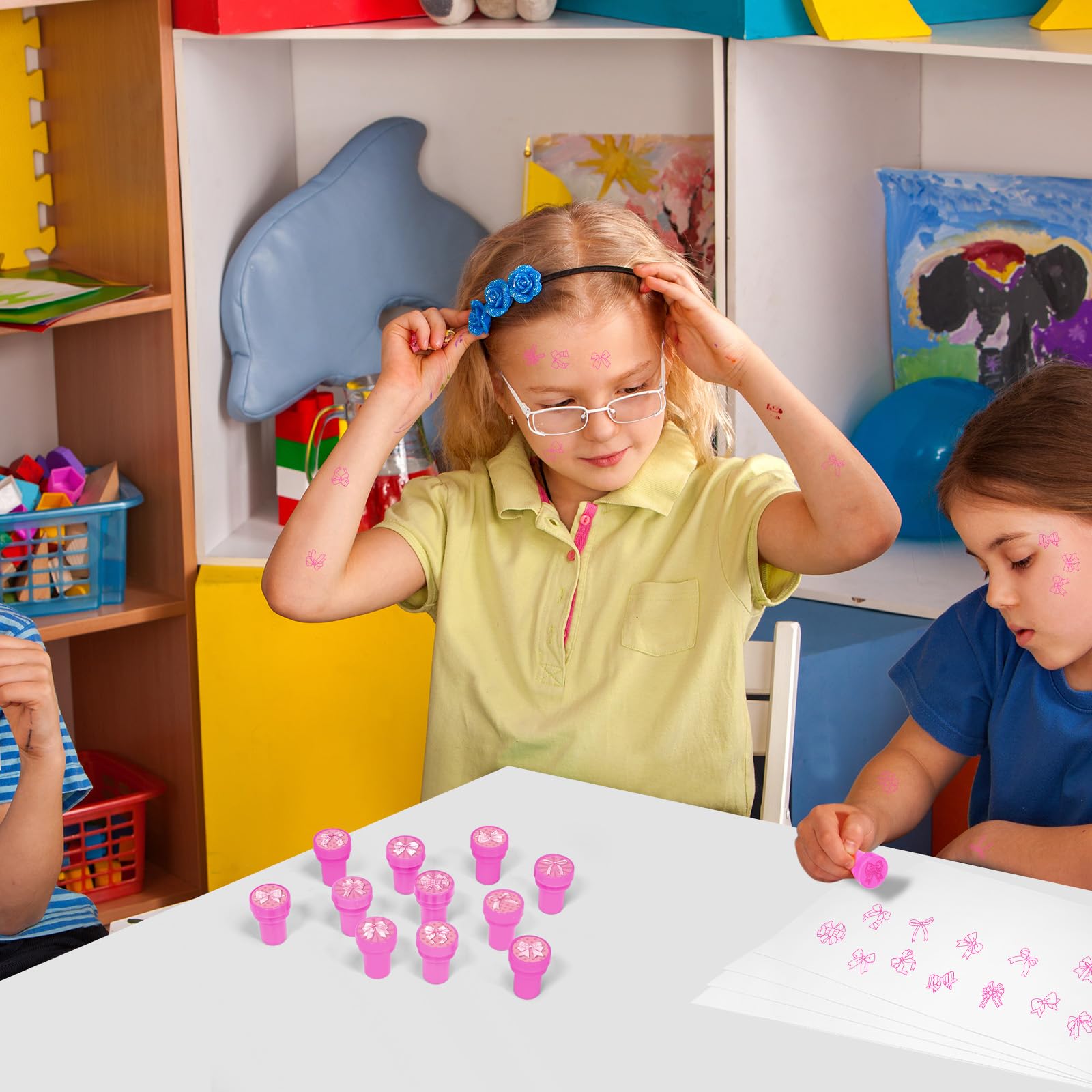 Party favors enhanced by Cinrobiye pink bow stampers for guests.
