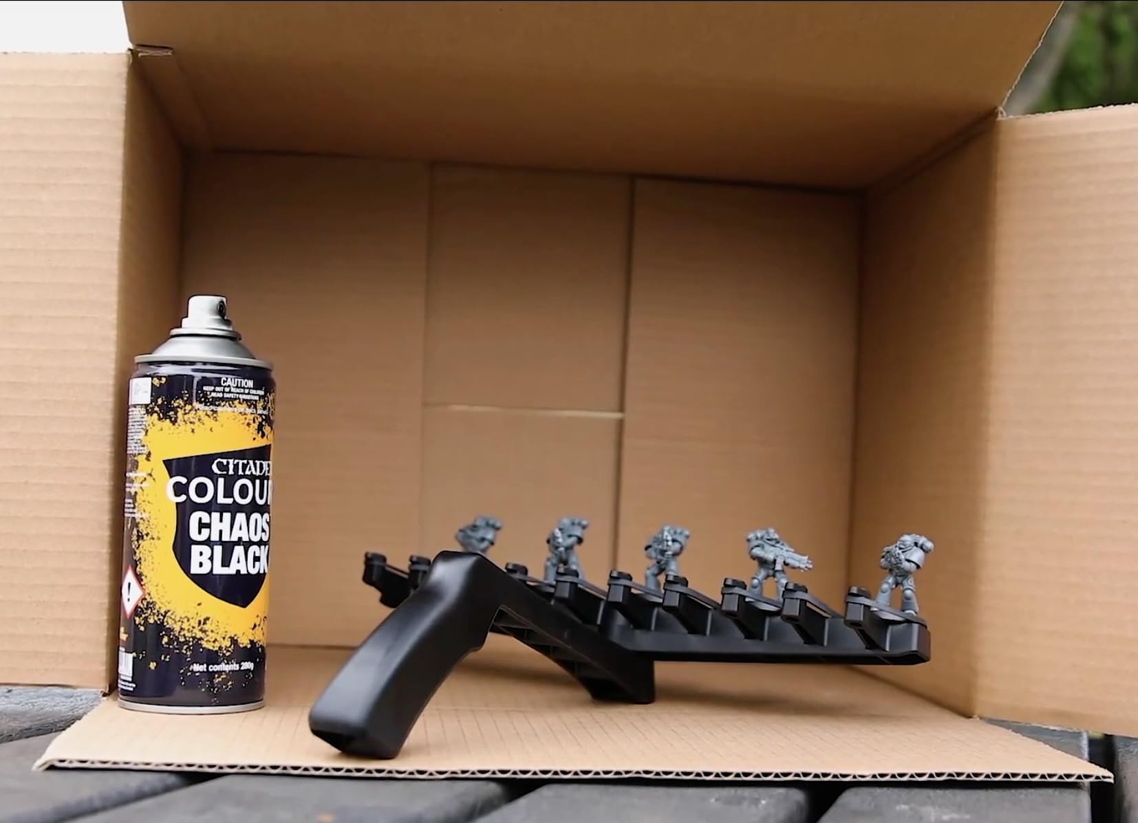 Citadel Chaos Black coverage on a miniature provides a smooth base layer.