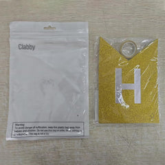 Clabby glitter gold banner wall display enhancing party ambiance.