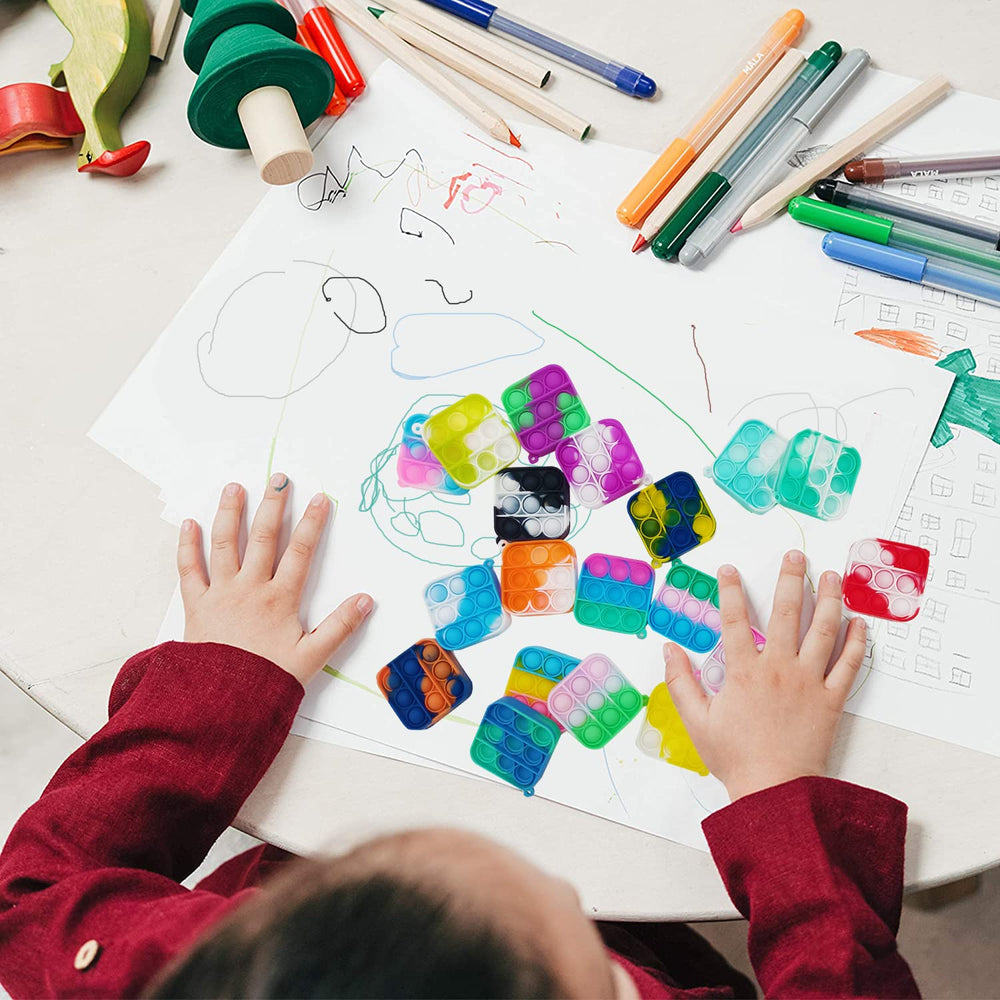 Clanam square bubble toy in hand, sensory play for focused, calm moments.