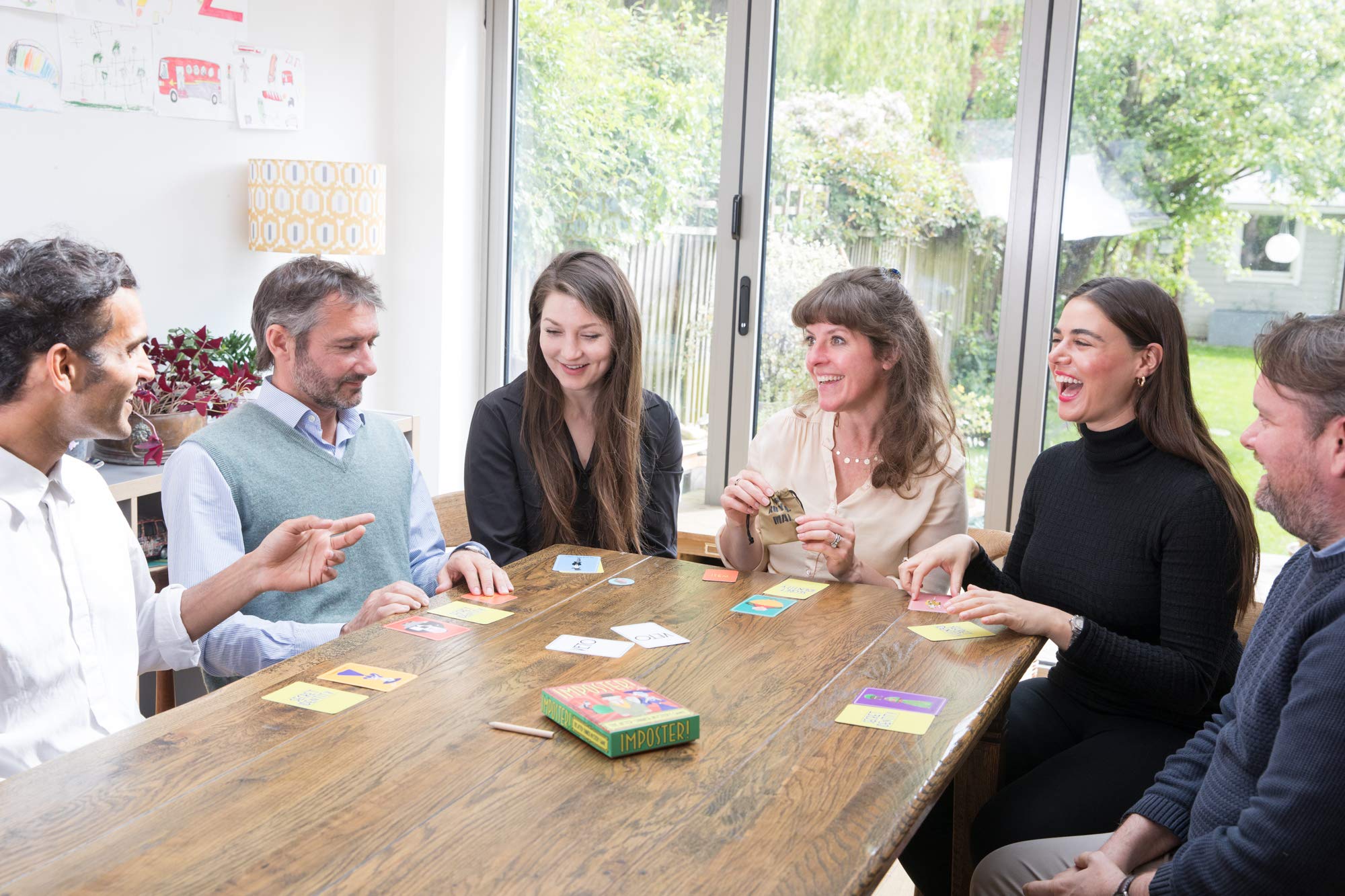Clarendon Games Imposter! party-night setup invites social fun and easy assembly.