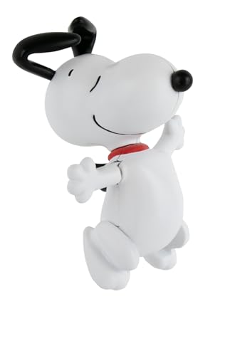 Classic wind-up Snoopy dancing toy showcasing playful motion in a tiny form.