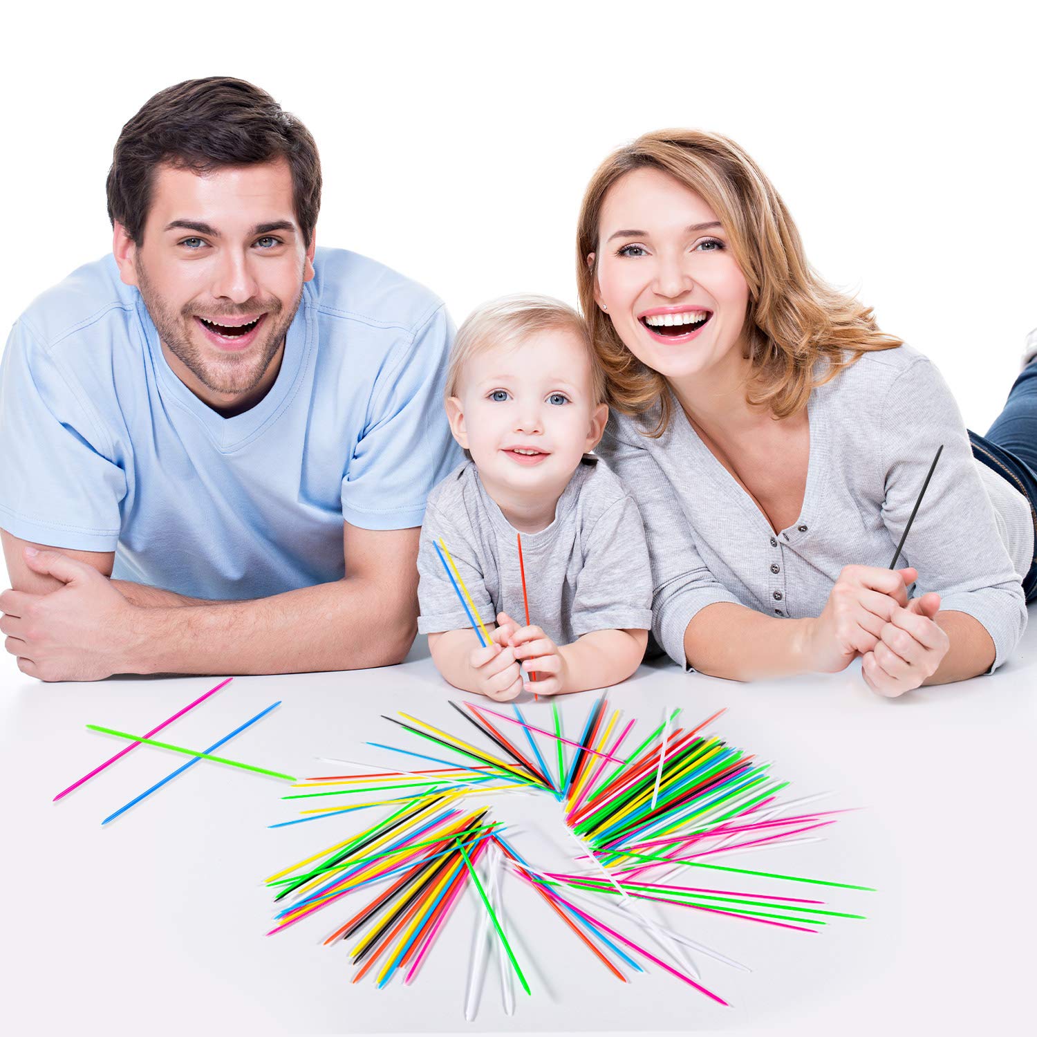 Kids and adults preparing a calm game setup with sticks on table