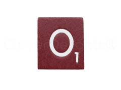 Close-up of CleverDelights maroon tiles showing indentations and wood texture for readability