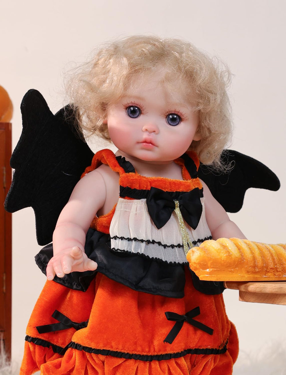 Socks and black shoes complete authentic witch outfit on Cloveray doll.