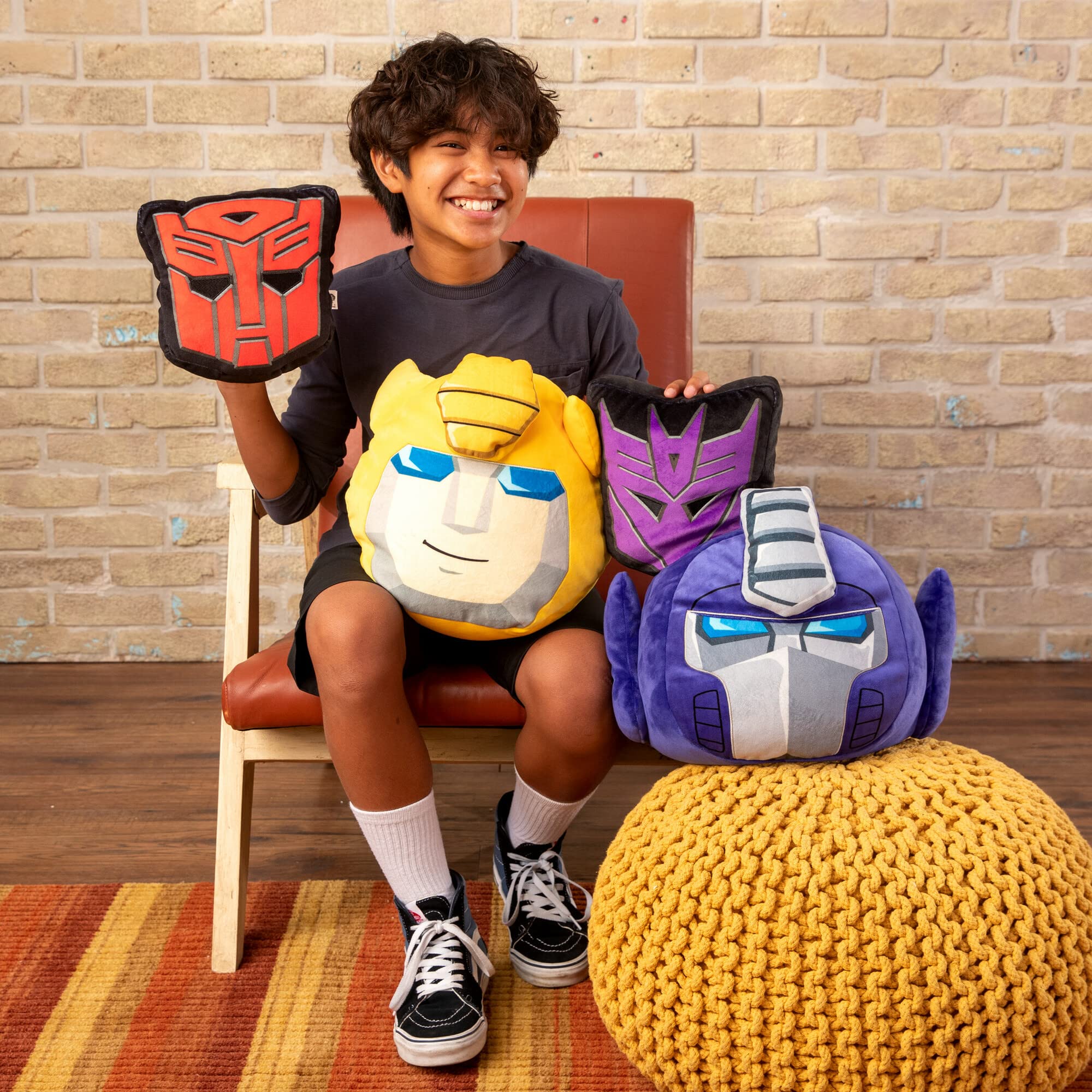 Room-ready Optimus Prime Plush showing Transformers flair on shelf or bed