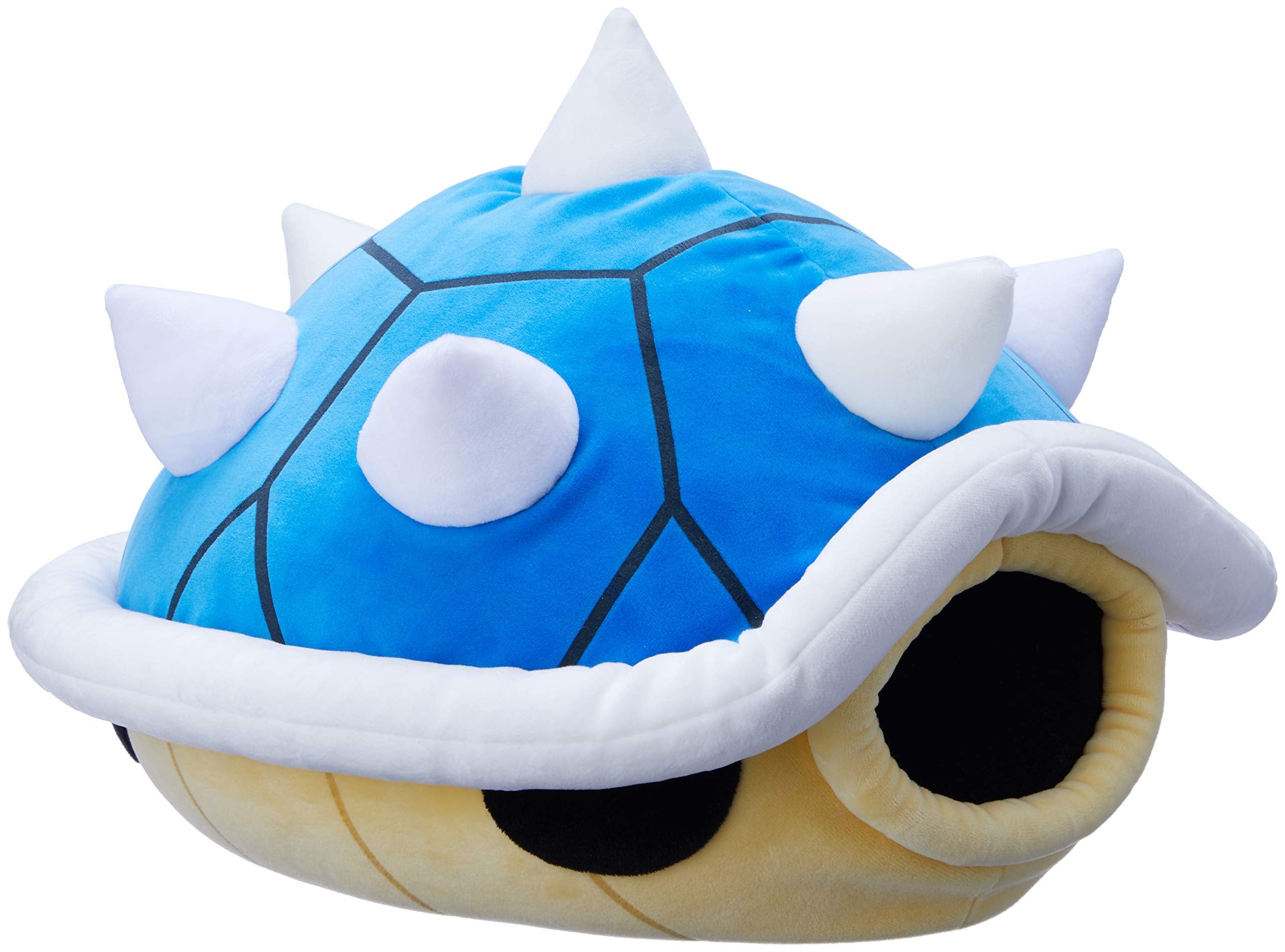 Spiny Shell character used as desk decor and cozy companion.