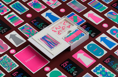CMYK Figment Magenta Edition on a tabletop illustrates cooperative play during a game night.