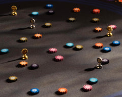 CMYK Lacuna board game packaging interior showing components and quick-start guide.