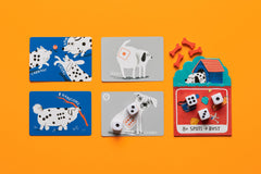 CMYK Spots Dice Game: match dice spots on playful dogs for engaging table time.